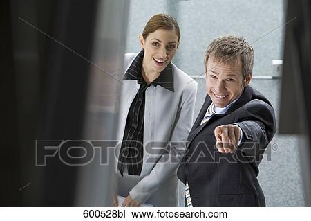 portrait of two executives man pointing towards camera View Large Photo Image Stock Image - portrait of two executives man pointing towards camera. Fotosearch