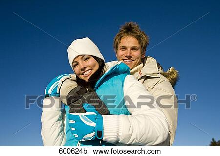 Stock Image - portrait of young couple in winter. Fotosearch