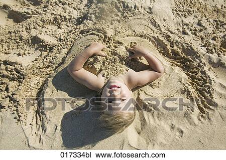 portrait of young girl buried in sand on beach View Large Photo Image Stock Image - portrait of young girl buried in sand on beach. Fotosearch