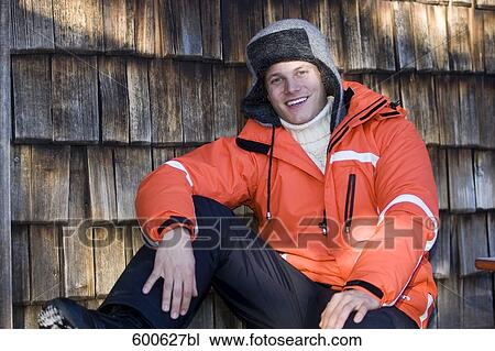 Stock Image - portrait of young man in winter clothes. Fotosearch