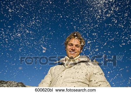 portrait of young man playing with snow View Large Photo Image Stock Image - portrait of young man playing with snow. Fotosearch
