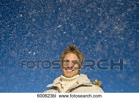portrait of young man playing with snow View Large Photo Image Stock Image - portrait of young man playing with snow. Fotosearch