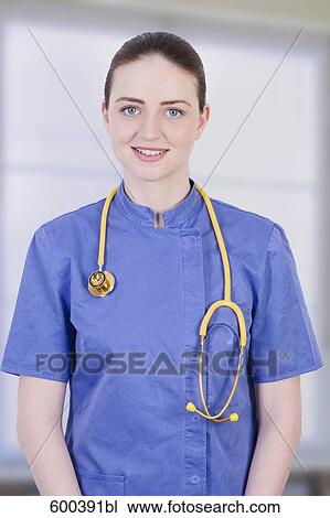Stock Image - portrait of young nurse with stethoscope. Fotosearch