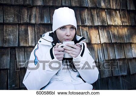 portrait of young woman in winter clothes having hot drink View Large Photo Image Stock Image - portrait of young woman in winter clothes having hot drink. Fotosearch
