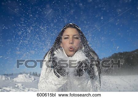 portrait of young woman playing with snow View Large Photo Image Stock Image - portrait of young woman playing with snow. Fotosearch