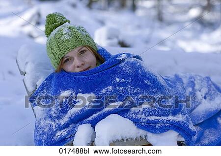 portrait of young woman sitting outdoors in winter covered with blanket View Large Photo Image Stock Image - portrait of young woman sitting outdoors in winter covered with blanket. Fotosearch