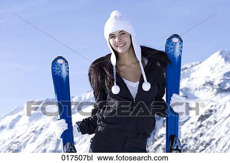 portrait of young woman with skis View Large Photo Image Stock Image - portrait of young woman with skis. Fotosearch