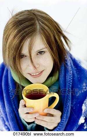 potrait of young woman in winter drinking hot tea View Large Photo Image Stock Image - potrait of young woman in winter drinking hot tea. Fotosearch