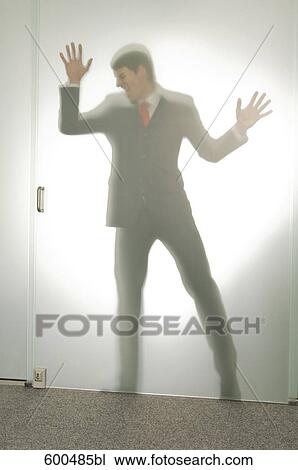 shape of businessman behind glass door View Large Photo Image Stock Image - shape of businessman behind glass door. Fotosearch