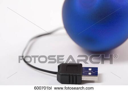 Stock Image - still life of bauble connected to computer cable. Fotosearch