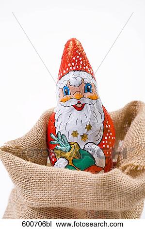 still life of chocolate santa claus in sack View Large Photo Image Stock Image - still life of chocolate santa claus in sack. Fotosearch