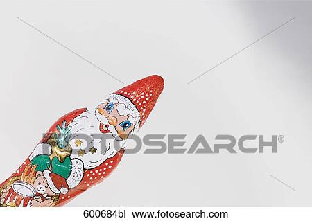 Stock Image - still life of chocolate santa claus. Fotosearch