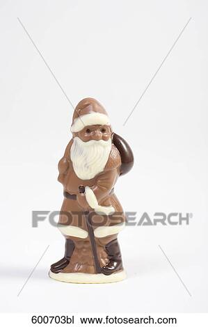 Stock Image - still life of chocolate santa claus. Fotosearch