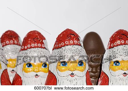 still life of chocolate santa clauses one already unwrapped View Large Photo Image Stock Image - still life of chocolate santa clauses one already unwrapped. Fotosearch