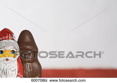 still life of chocolate santa clauses one already unwrapped View Large Photo Image Stock Image - still life of chocolate santa clauses one already unwrapped. Fotosearch