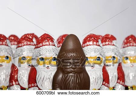 still life of chocolate santa clauses one already unwrapped View Large Photo Image Stock Image - still life of chocolate santa clauses one already unwrapped. Fotosearch