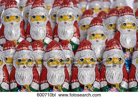 Stock Image - still life of chocolate santa clauses. Fotosearch