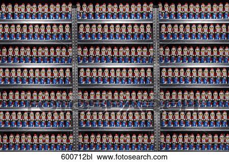 Stock Image - still life of chocolate santa clauses in shelf. Fotosearch