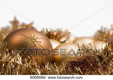 still life of golden baubles and garlands View Large Photo Image Stock Image - still life of golden baubles and garlands. Fotosearch