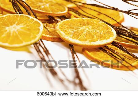 still life of orange slices and twigs View Large Photo Image Stock Image - still life of orange slices and twigs. Fotosearch