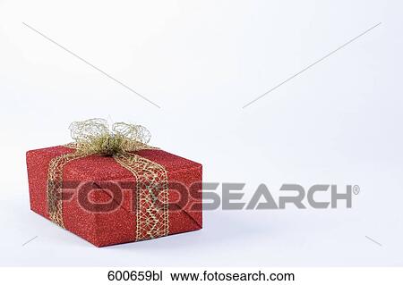 still life of red present with golden ribbon View Large Photo Image Stock Image - still life of red present with golden ribbon. Fotosearch