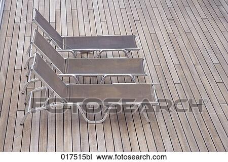 three sunloungers on deck of cruise ship View Large Photo Image Stock Image - three sunloungers on deck of cruise ship. Fotosearch