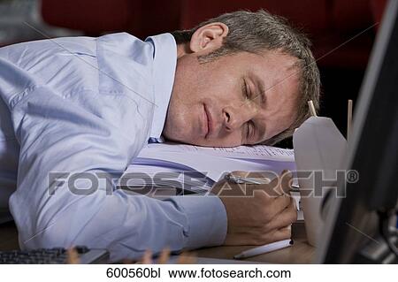 tired businessman asleep at his desk View Large Photo Image Stock Image - tired businessman asleep at his desk. Fotosearch