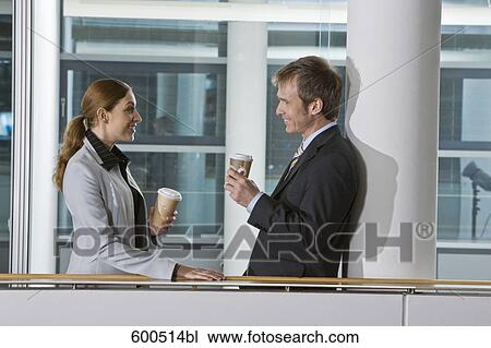 two executives having coffee break and flirting with each other View Large Photo Image Stock Image - two executives having coffee break and flirting with each other. Fotosearch