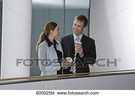 two executives having coffee break and flirting with each other View Large Photo Image Stock Image - two executives having coffee break and flirting with each other. Fotosearch