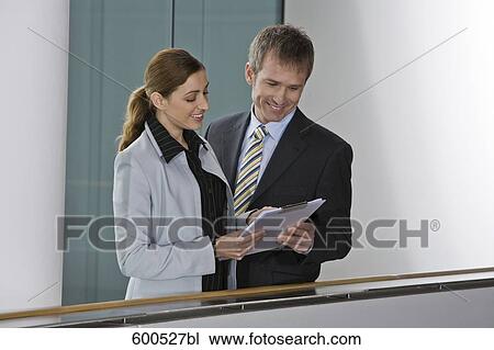 two executives reading document View Large Photo Image Stock Image - two executives reading document. Fotosearch