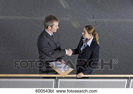 two executives shaking hands View Large Photo Image Stock Image - two executives shaking hands. Fotosearch