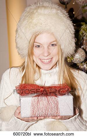 young woman with christmas present View Large Photo Image Stock Image - young woman with christmas present. Fotosearch