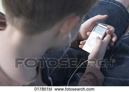 boy listening to music on ipod View Large Photo Image Stock Image - boy listening to music on ipod. Fotosearch