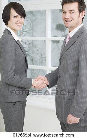 businesswoman and businessman shaking hands View Large Photo Image Stock Image - businesswoman and businessman shaking hands. Fotosearch