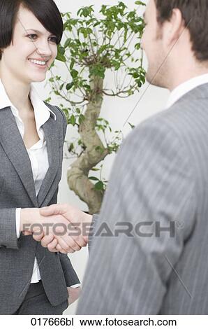 businesswoman and businessman shaking hands View Large Photo Image Stock Image - businesswoman and businessman shaking hands. Fotosearch