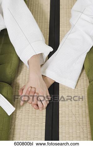 close-up of couple relaxing in spa holding hands View Large Photo Image Stock Image - close-up of couple relaxing in spa holding hands. Fotosearch