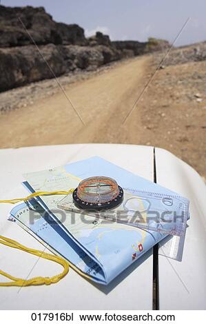 compass and map on car on desert road View Large Photo Image Stock Image - compass and map on car on desert road. Fotosearch