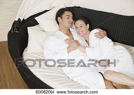 couple lying in close embrace View Large Photo Image Stock Image - couple lying in close embrace. Fotosearch