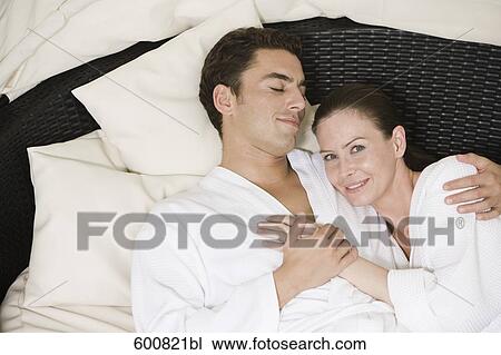 couple lying in close embrace View Large Photo Image Stock Image - couple lying in close embrace. Fotosearch
