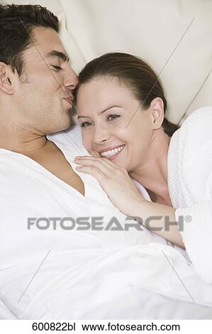 couple lying in close embrace View Large Photo Image Stock Image - couple lying in close embrace. Fotosearch