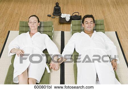 couple relaxing in spa holding hands View Large Photo Image Stock Image - couple relaxing in spa holding hands. Fotosearch