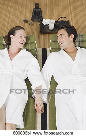 couple relaxing in spa holding hands View Large Photo Image Stock Image - couple relaxing in spa holding hands. Fotosearch