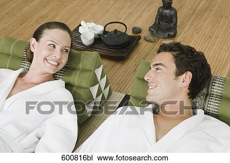 couple relaxing in spa smiling at each other View Large Photo Image Stock Image - couple relaxing in spa smiling at each other. Fotosearch