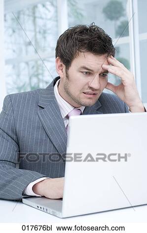 desperate businessman working with laptop computer View Large Photo Image Stock Image - desperate businessman working with laptop computer. Fotosearch