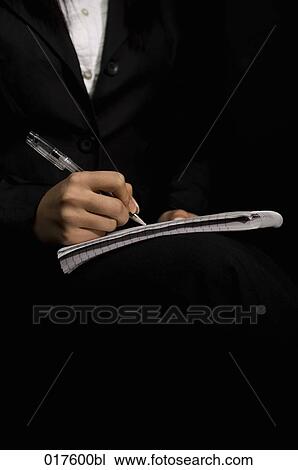 detail of businesswoman writing on pad View Large Photo Image Stock Image - detail of businesswoman writing on pad. Fotosearch