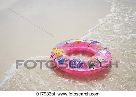 floating tyre on sandy beach View Large Photo Image Stock Image - floating tyre on sandy beach. Fotosearch
