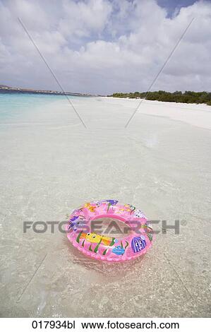 floating tyre on sandy beach View Large Photo Image Stock Image - floating tyre on sandy beach. Fotosearch