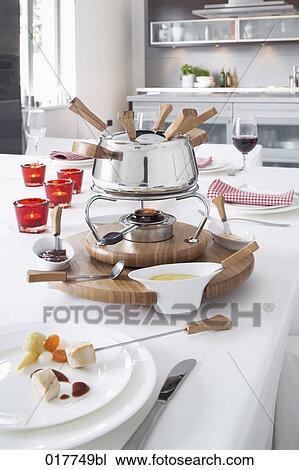 fondue on table in kitchen View Large Photo Image Stock Image - fondue on table in kitchen. Fotosearch