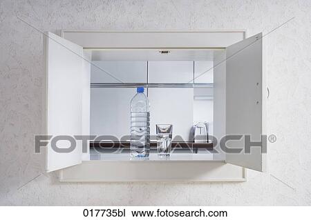 glass of water and plastic bottle in pass-through to kitchen View Large Photo Image Stock Image - glass of water and plastic bottle in pass-through to kitchen. Fotosearch