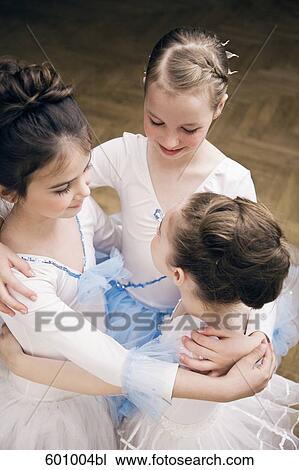 group of three young ballet dancers in close embrace View Large Photo Image Stock Image - group of three young ballet dancers in close embrace. Fotosearch